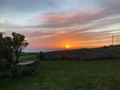 Lovely spacious flat with sea views, sunsets, garden and woodburner